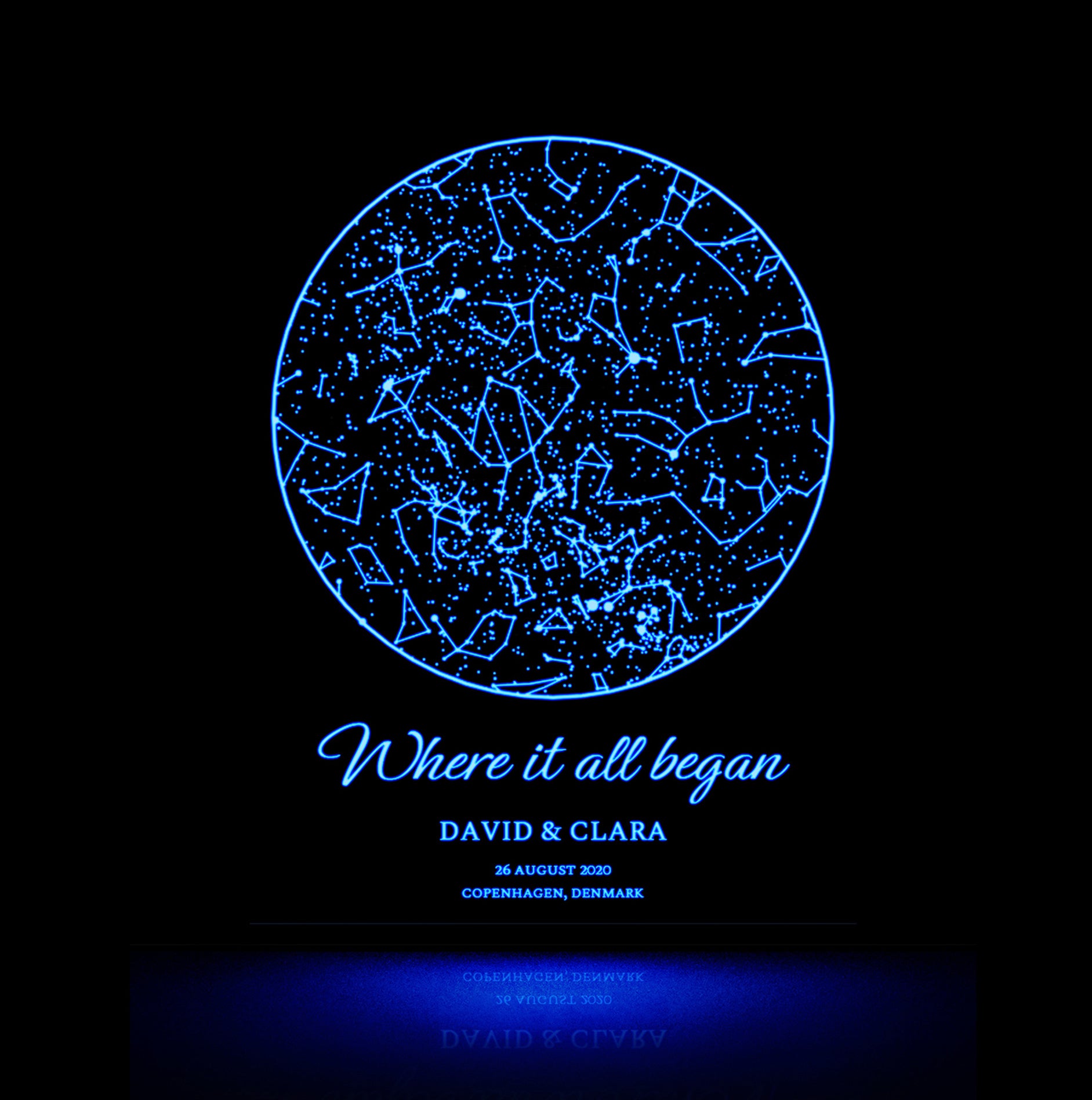 Personalized star map glowing in the dark with a light blue glow.