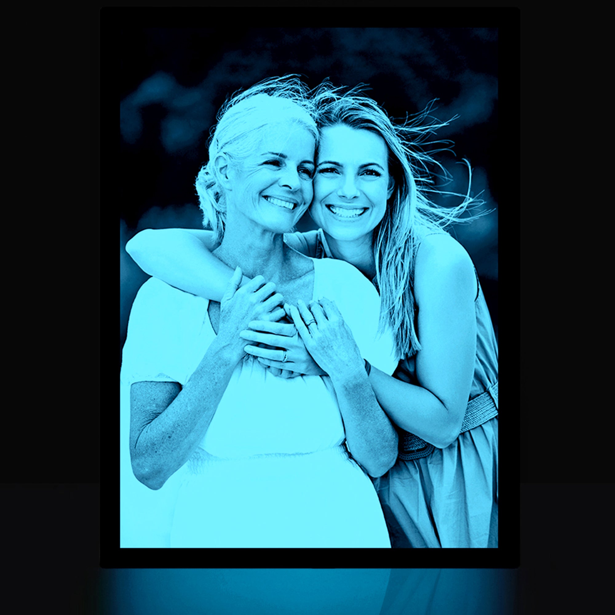 Personalized photo glowing in the dark with a light blue glow.